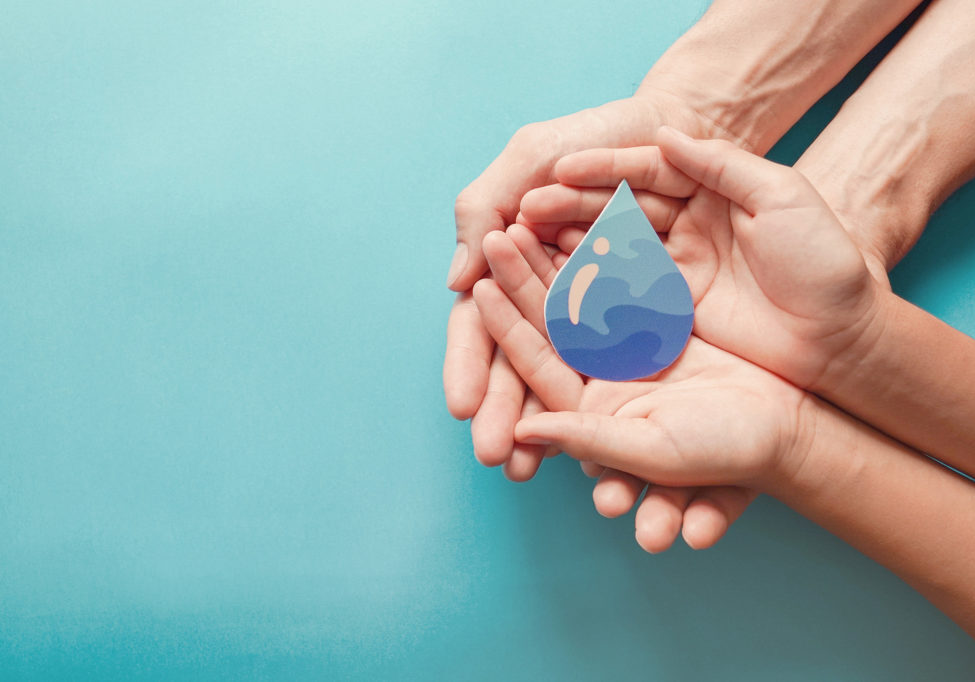 Adult and child hands holding paper cut water drop, World Water Day,  Clean water and sanitation, CSR, save water,  ecology concept